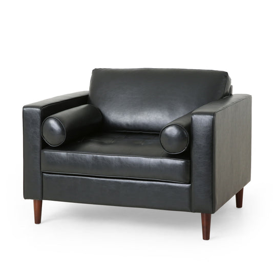 The Sophisticated Club Chair With Relaxing Comfort features modern black leather, square arms, a tufted seat, two bolster pillows, and wooden legs, shown against a plain white background.