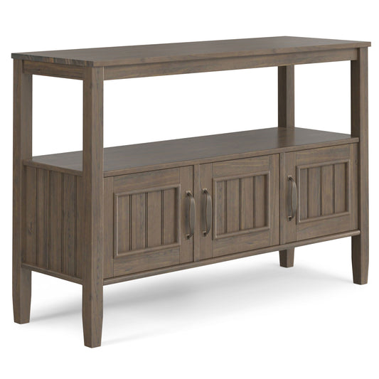 The Lev Console Table in Smoky Brown features an open top shelf, two paneled cabinet doors with metal handles, and a stylish vertical panel design.