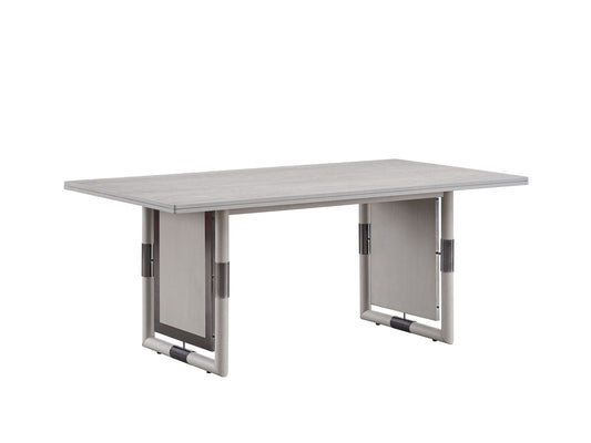 The Marta Dining Table features a modern rectangular design with a natural wood surface and distinctive panel legs with metal accents, showcased against a plain white background.