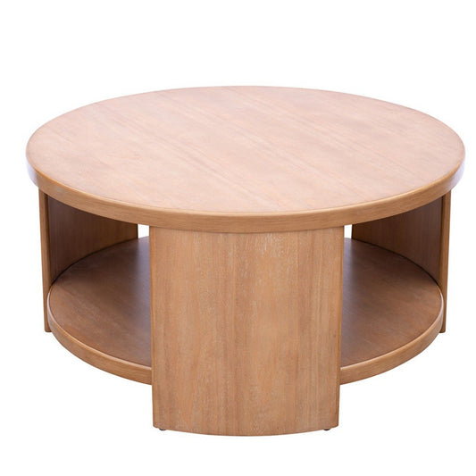 The Modern Minimalist Round Coffee Table With Shelf Storage - Natural features a light wood finish, a lower shelf, and three vertical panels connecting the top and bottom surfaces.