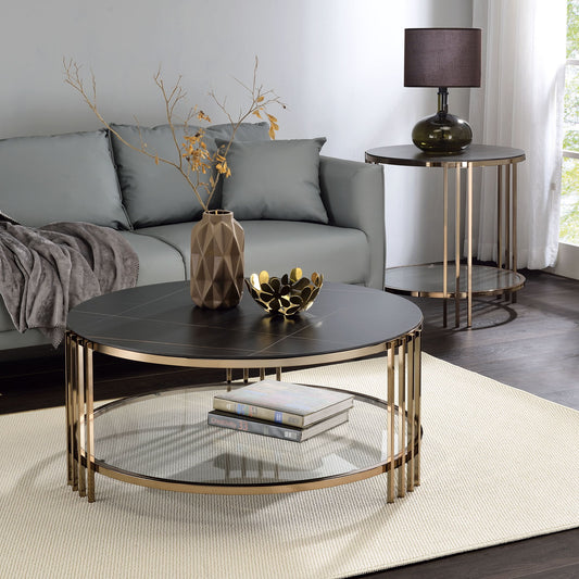 Modern living room with a gray sofa, Abisha Sintered Stone Top Round Table holding a geometric vase and decorative bowl, side table with lamp, white rug, and sunlight streaming through the window.