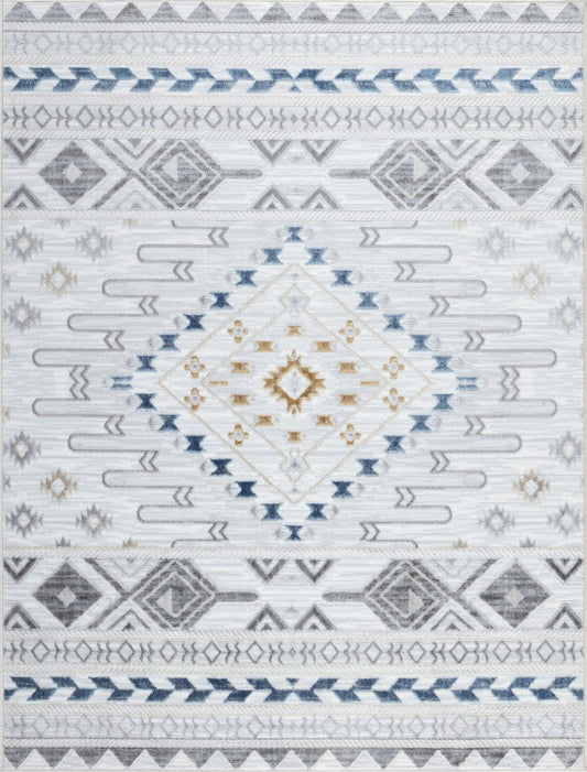 The Legacy - GC_CAM8001 Area Rug features a geometric pattern in blue, gray, and beige on white, with a large central diamond and rows of smaller diamonds, arrows, and zigzags.