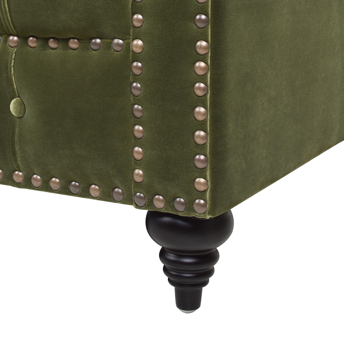 Close-up of Alto - Tufted Chesterfield Sofa in green upholstery, showcasing decorative brass nailhead trim and a black turned wooden leg.