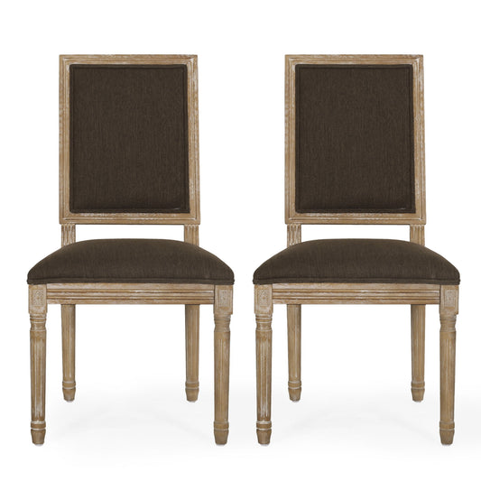 Two French Country Style Dining Chairs with dark upholstered seats and backs, fluted legs, and light weathered frames are placed side by side against a white background.