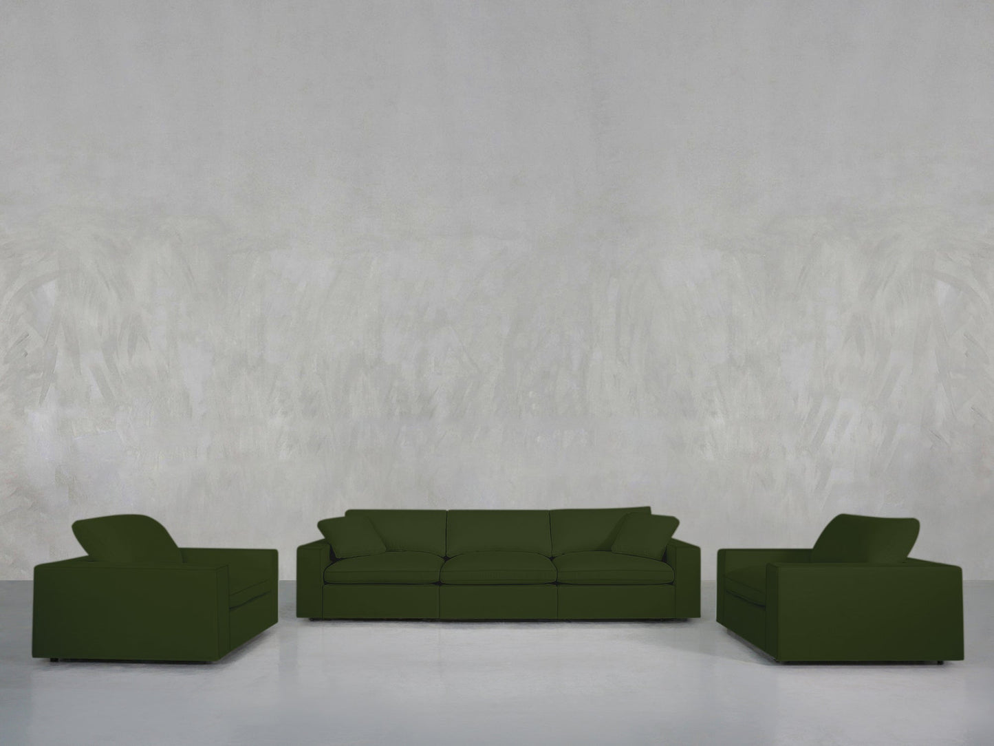 The 3-1-1 Sofa & Armchair Set in dark green is arranged in a minimalistic, spacious room with a pale textured wall and glossy white floor, creating an uncluttered scene that highlights the furniture and open space.