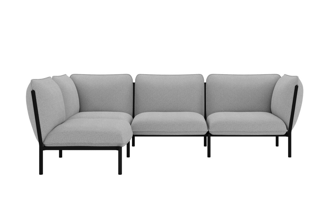 The Kumo Corner Sofa Left with Armrest features gray upholstered cushions and black metal legs, arranged in an L-shape that highlights its modern, minimalist design. The plush cushions promise a high level of comfort.