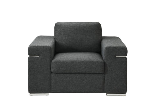 The Gianna Fabric Arm Chair features a modern dark gray design with wide armrests, rectangular cushions, and metal legs, shown from the front against a white background.