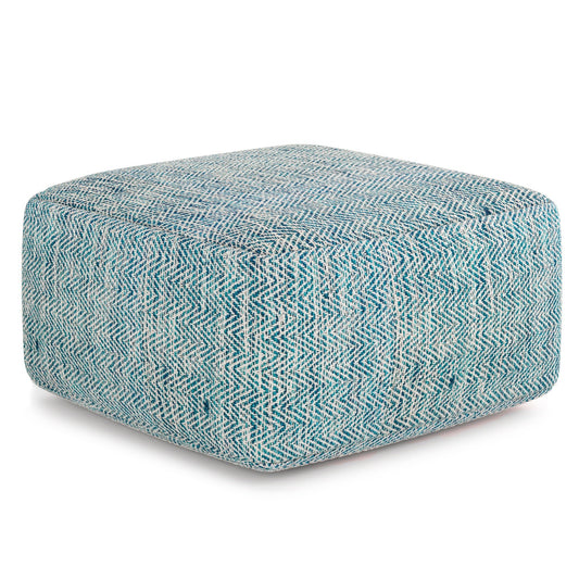 The Nate - Handcrafted Square Pouf features a blue and white herringbone pattern fabric in a stylish square design.