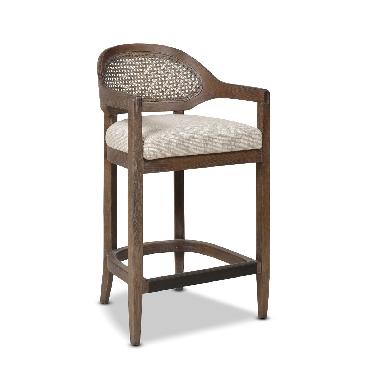 The Americana Mid-Century Modern Cane Back Counter Stool features a curved, woven cane backrest, upholstered beige seat cushion, and four straight legs with a footrest for comfort.