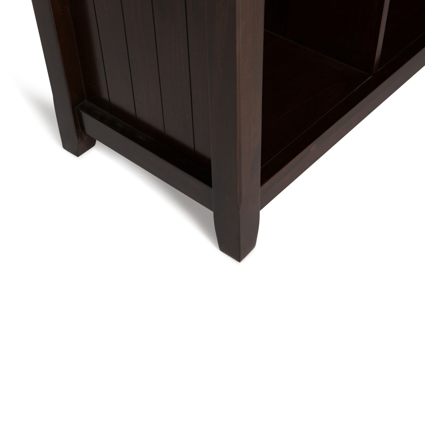 Close-up view of the dark wood corner and leg of the Acadian - Handcrafted Cube Storage, set against a white background.