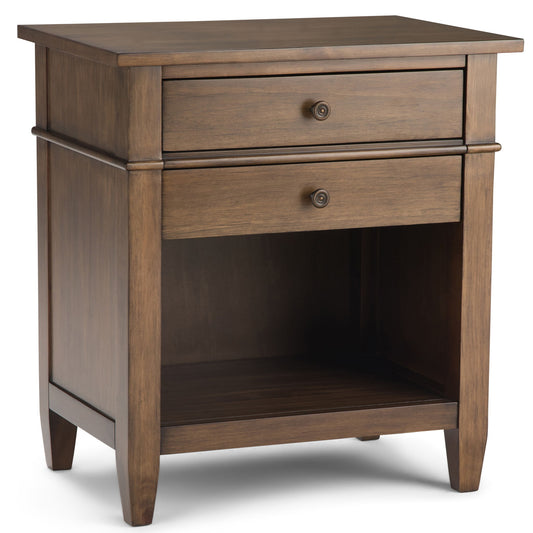 The Carlton Bedside Table features two drawers with small knobs, an open lower shelf, a rustic natural aged brown finish, and slightly tapered legs.