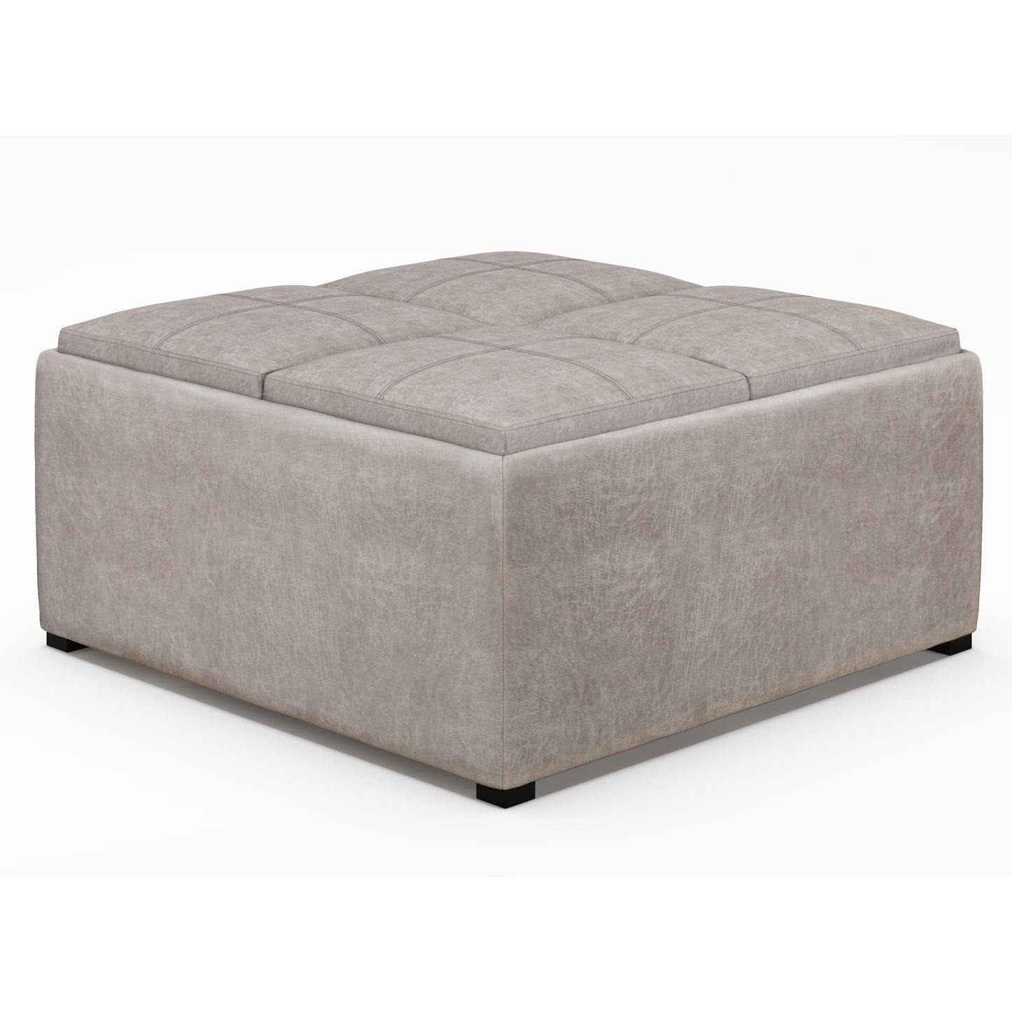 The Avalon Square Coffee Table Storage Ottoman features a large, light gray upholstered design with a tufted top and low black feet, shown against a plain white background.