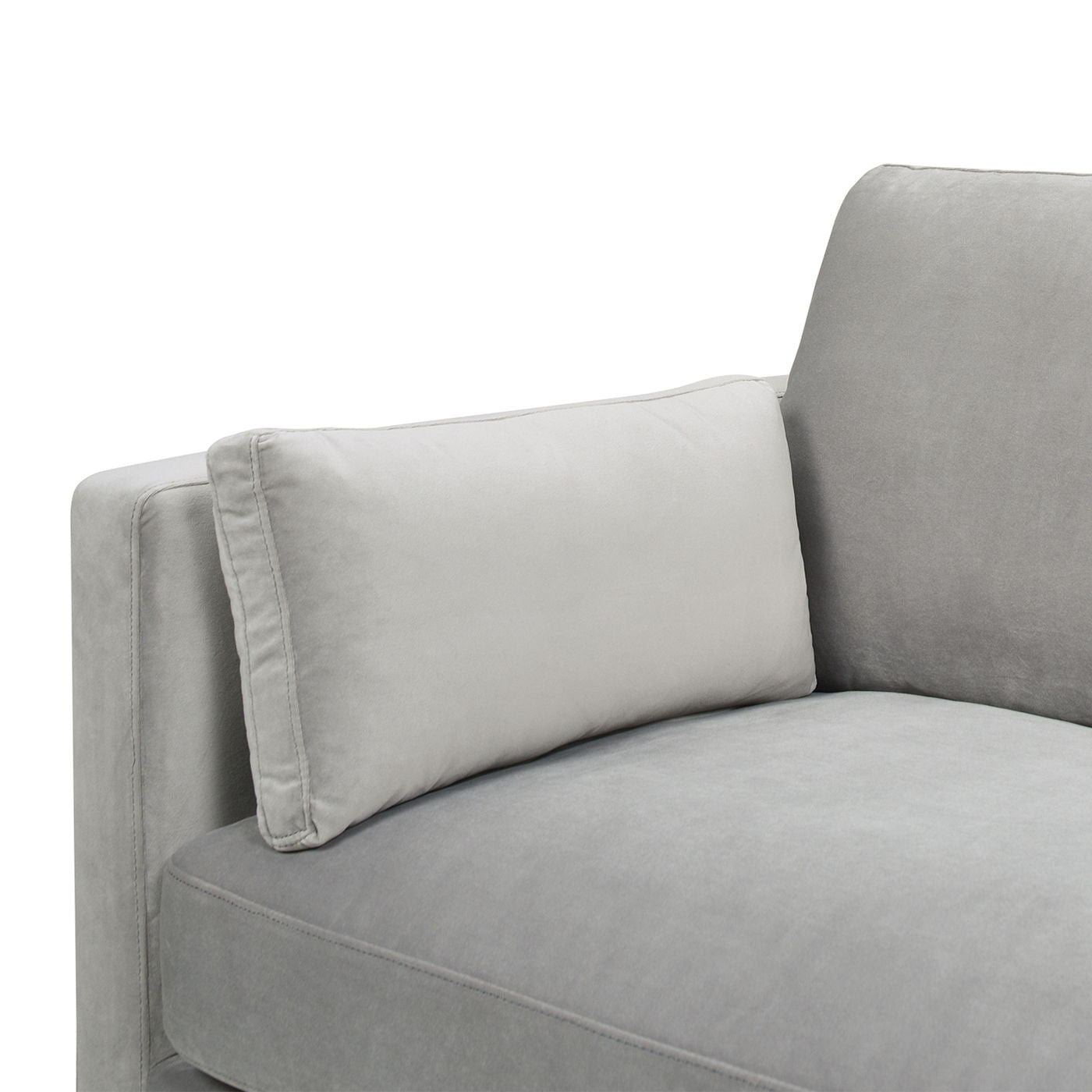 A close-up of the Knox - Modern Farmhouse Sofa in light gray, featuring a soft, plush fabric and a matching rectangular pillow resting against the armrest and backrest.