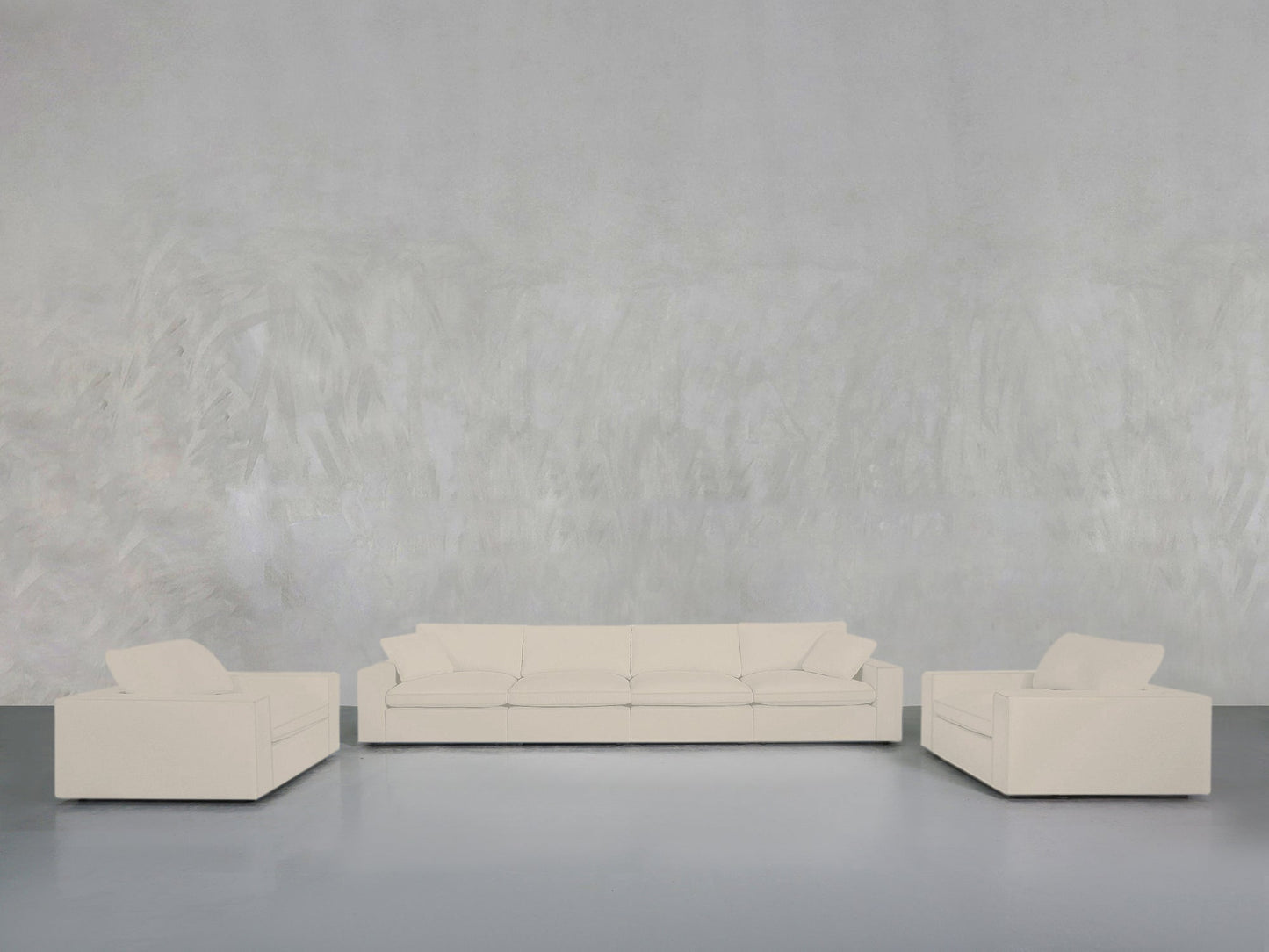 The 4-1-1 Sofa & Armchair Set is displayed in a minimalist living room with white, modern pieces arranged against a light gray textured wall and smooth gray floor for a clean, simple look.