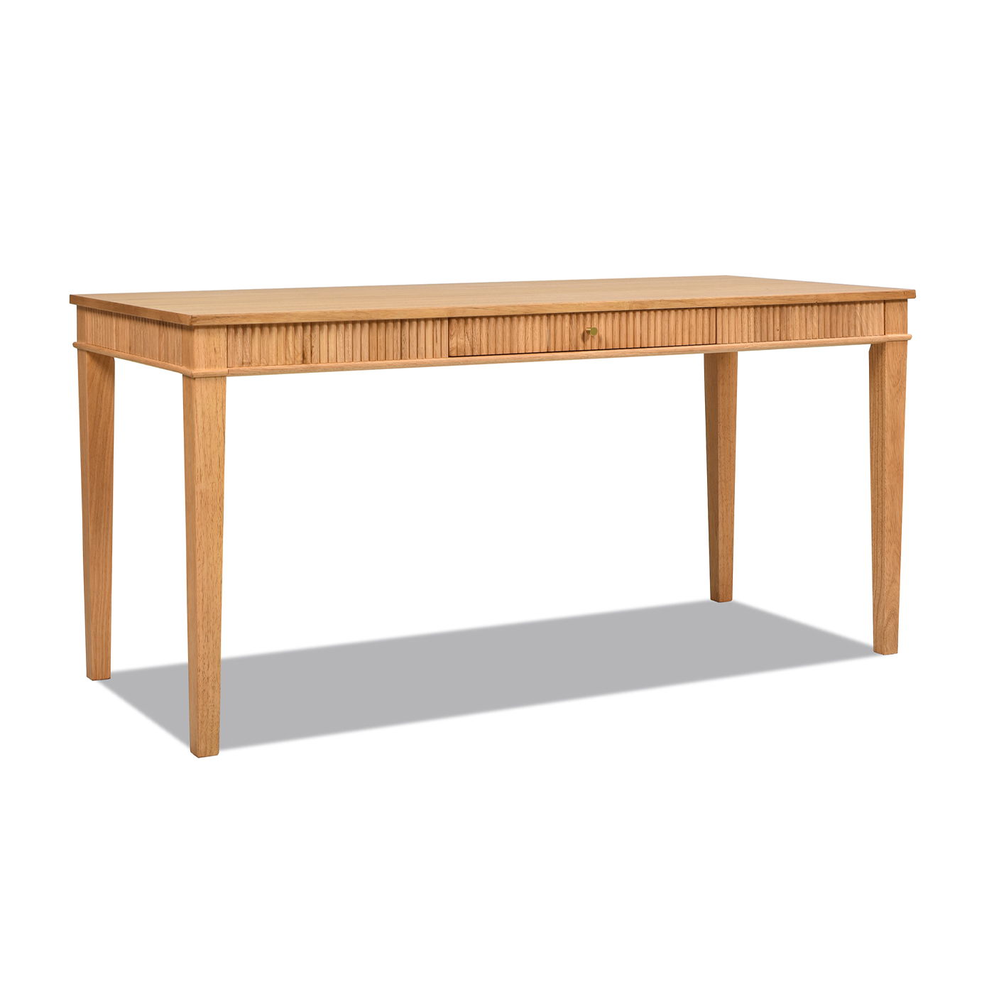 The Dumont Modern Farmhouse 1 Drawer Fluted Home Office Writing Desk in Natural Blonde features fluted front detailing, a central drawer, and tapered legs, shown against a white background.