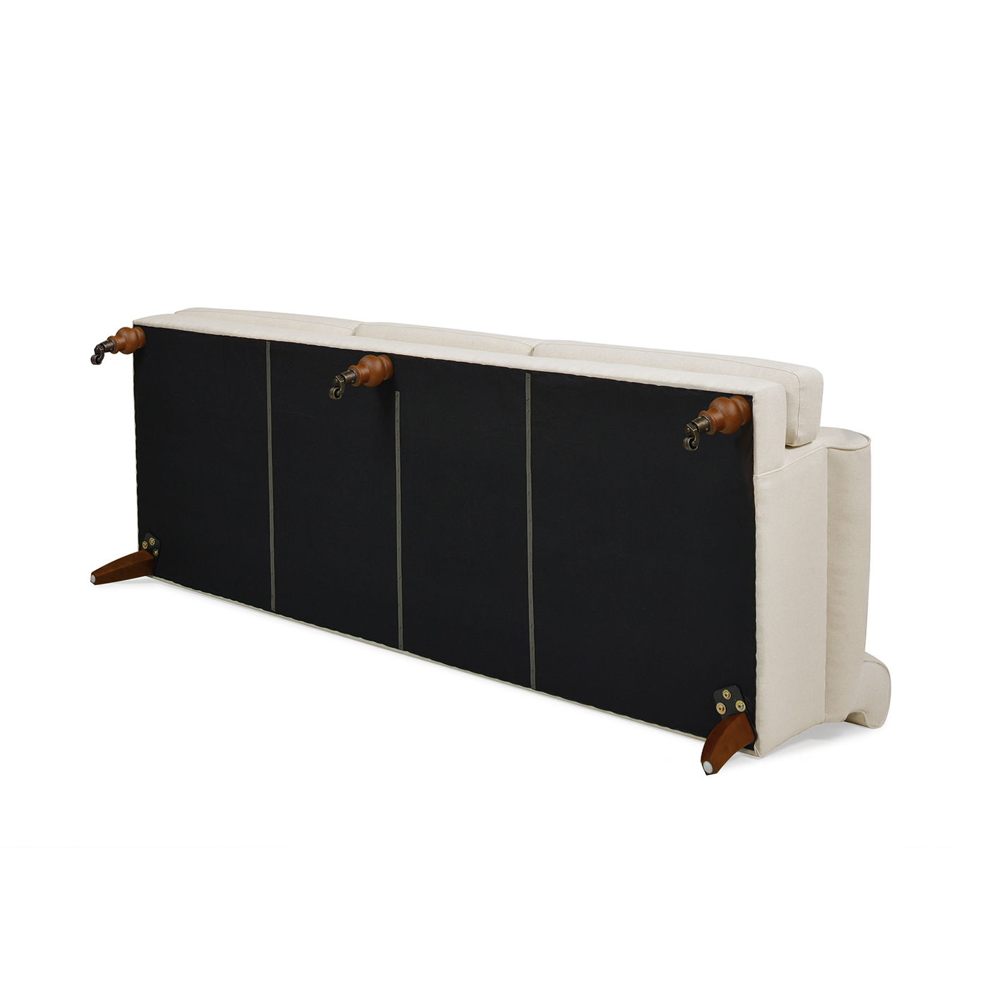 The Alana Lawson Three Cushion Tightback Sofa in beige upholstery is shown from the back and bottom, highlighting its wooden legs, black fabric underside, and visible hardware attachments.