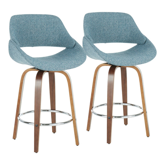 Set of 2 Fabrico mid-century modern counter stools featuring curved wooden legs, metal round footrests, and light blue upholstered seats and backs with an open lower back design.