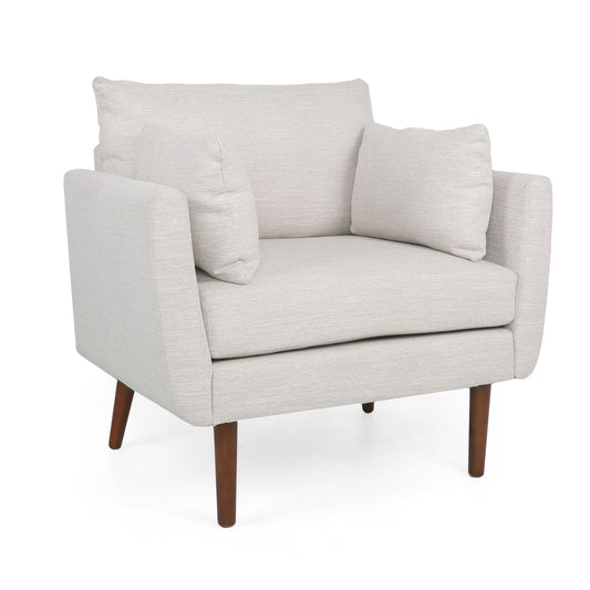 The Luminate Upholstered Fabric Club Chair features light beige fabric, two accent pillows, and four tapered wooden legs, all set against a plain white background.