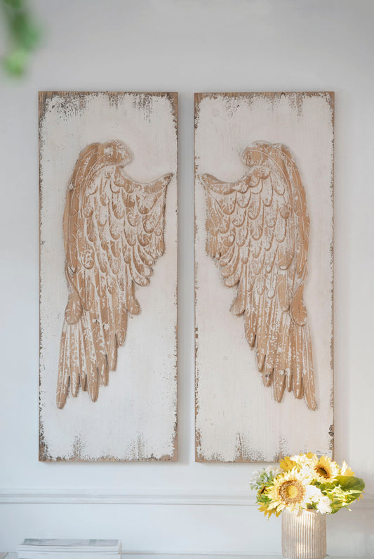 Two Feather Wing Wall Panels With Distressed, Rectangle Hanging Wall Art (Set of 2) - Multicolor hang side by side on a white wall. A vase with sunflowers and white flowers is placed nearby in the lower right corner.