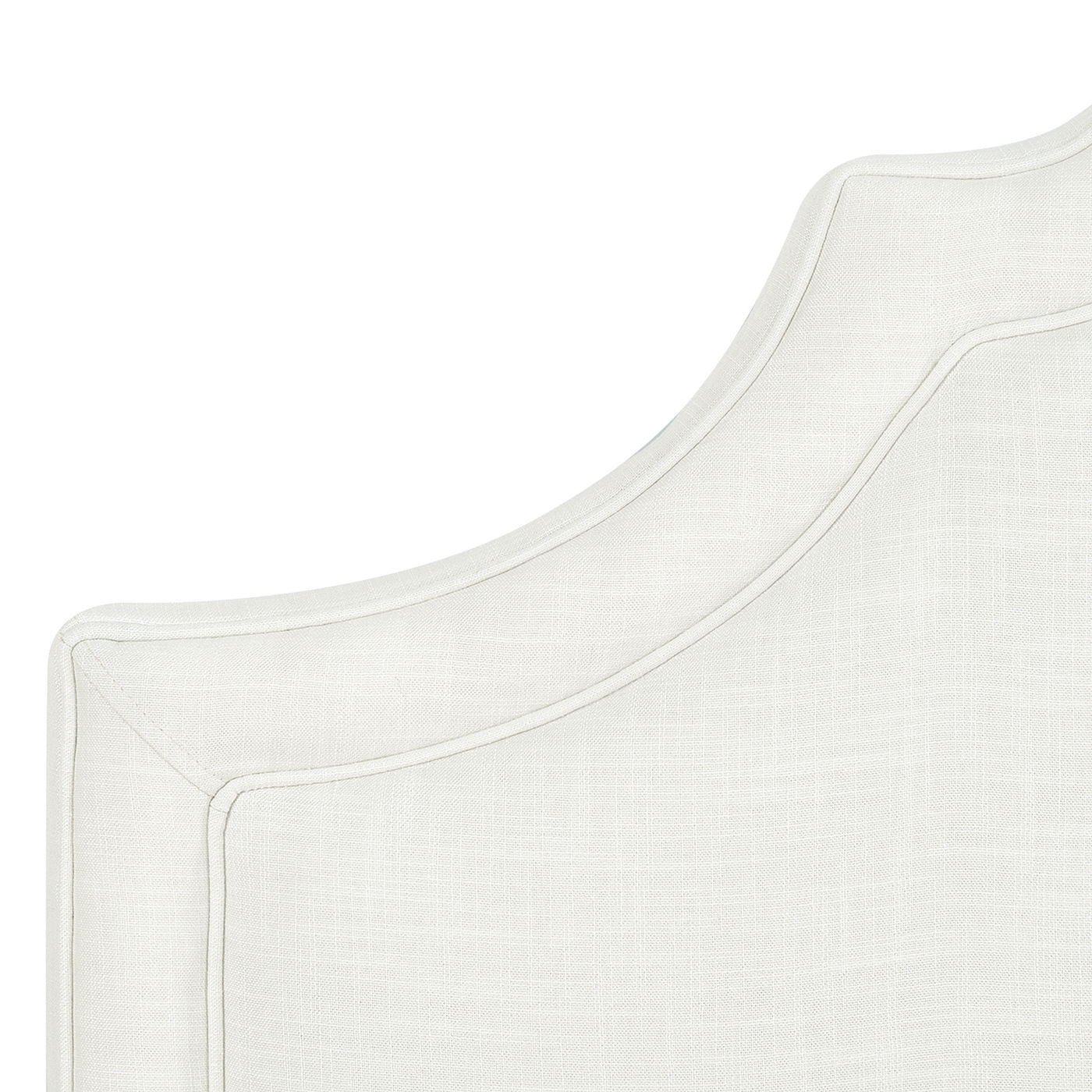Close-up of the upper corner of the Catherine - Luxurious Comfort Upholstered Headboard, featuring light-colored fabric, a curved decorative edge, and visible stitching details.