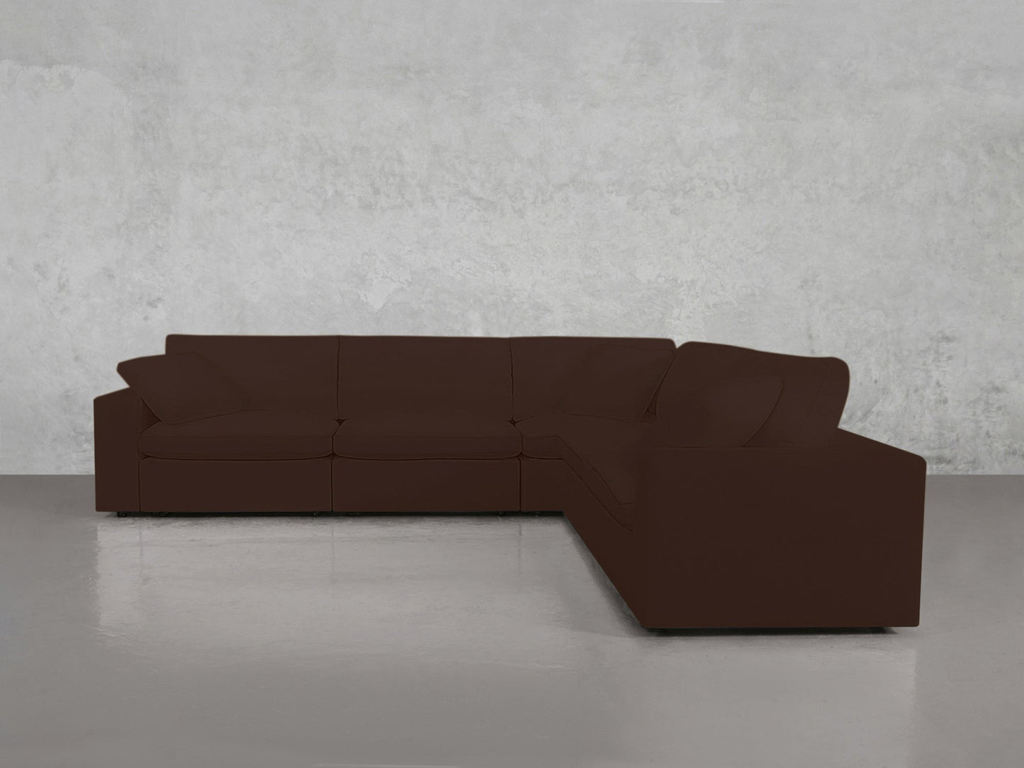 A 5-Seat Modular Corner Sectional in dark brown, featuring clean lines, is arranged in a minimalist room with light gray walls and a glossy gray floor.