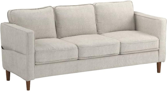 The Mellow Modern Loveseat with Armrest Pockets is a light beige three-seater with square armrests, three seat and back cushions, wooden legs, and a modern minimalist design.