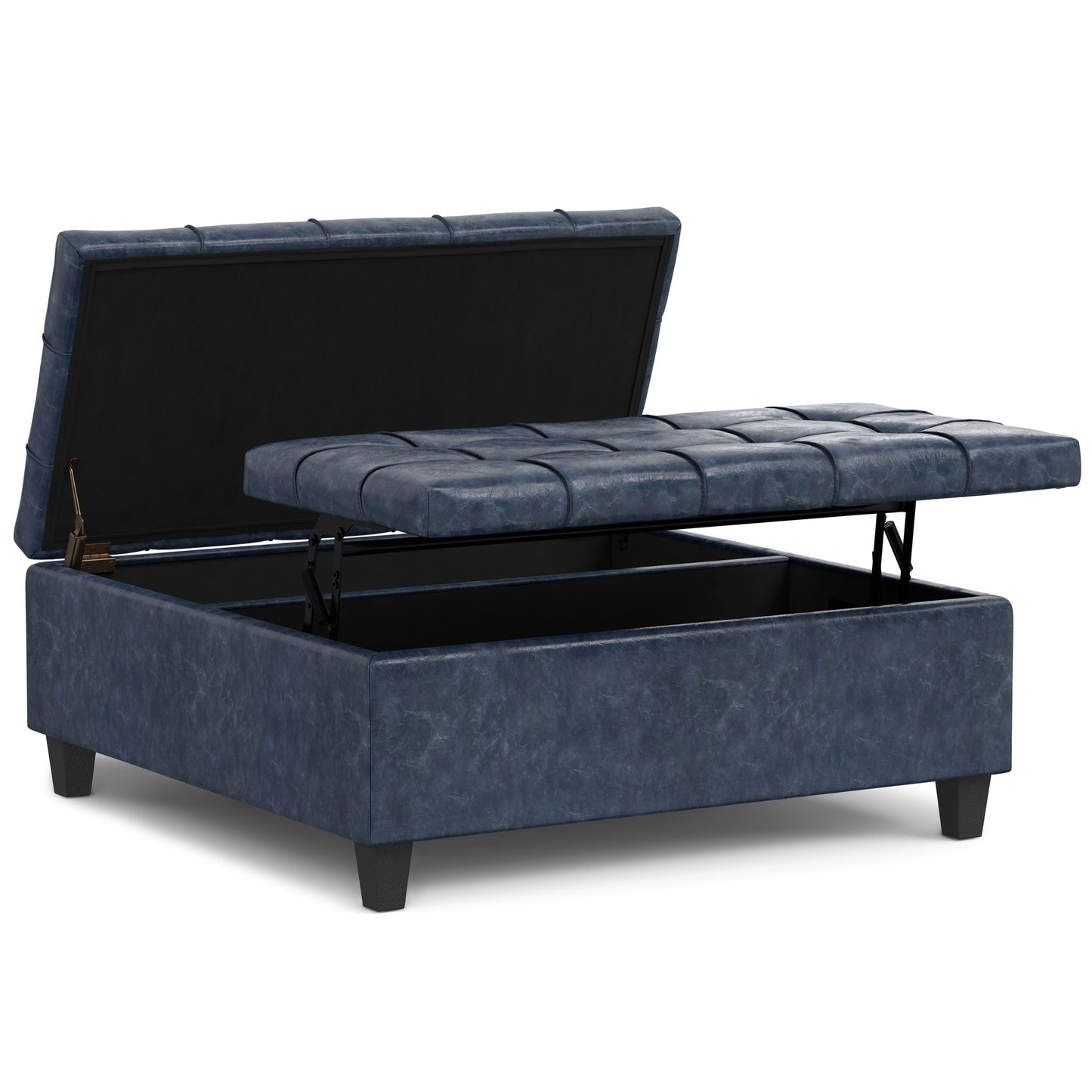 The Harrison Upholstered Coffee Table Storage Ottoman features dark blue upholstery, a cushioned tufted lift-top that reveals hidden storage, and stands on four short black legs.