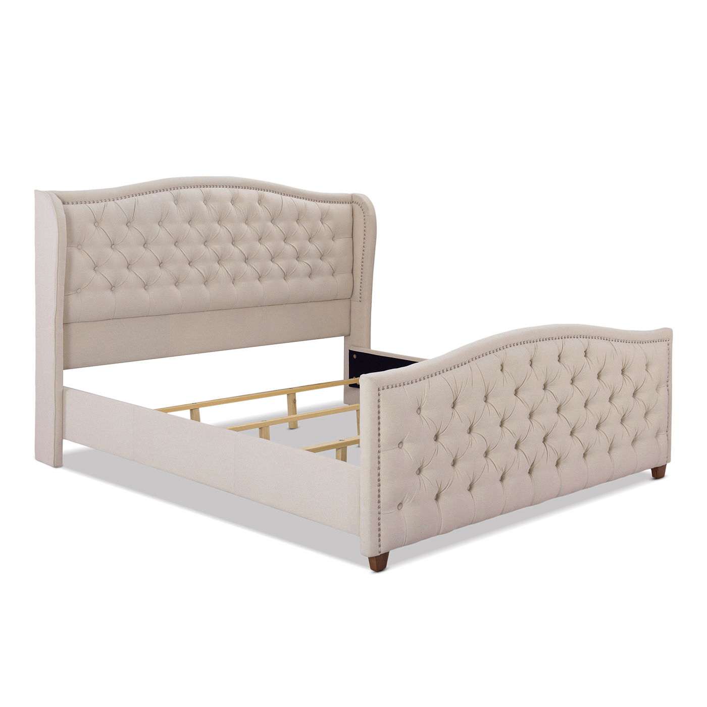The Marcella Upholstered Shelter Headboard Bed Set features a beige tufted, curved headboard and footboard, wooden legs, and decorative nailhead trim. Frame is shown without mattress or bedding.