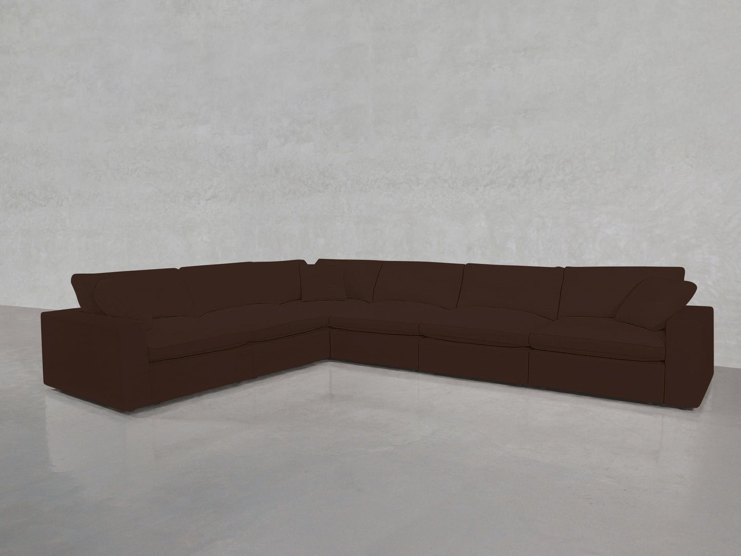 A 6-Seat Modular Corner Sectional in dark brown is placed on a shiny, light gray floor against a plain, light gray wall.