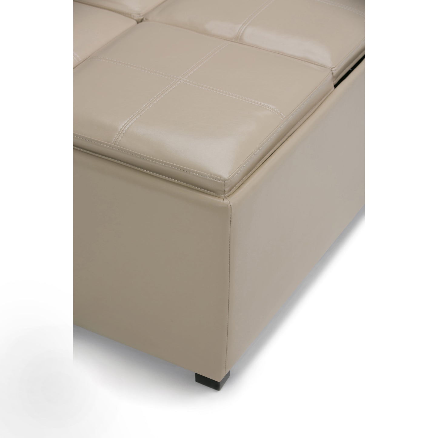 Close-up of the Avalon Square Coffee Table Storage Ottoman in beige leather with visible stitching, cushioned top, and short black legs, shown on a white background.