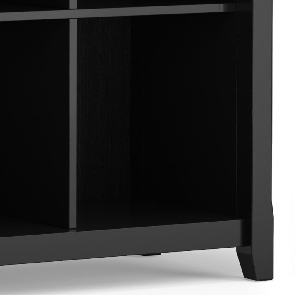 Close-up of the lower corner of the Acadian - Handcrafted Cube Storage in black wood, showing empty rectangular compartments and part of its leg at the bottom right.