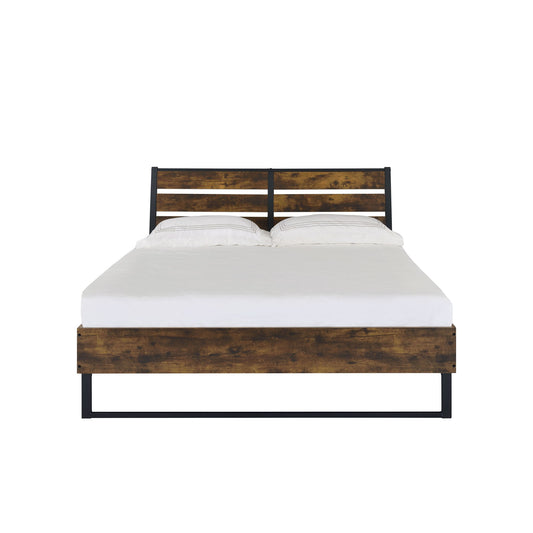 The Juvanth - Rustic Bed features a wooden frame with a rustic finish, black metal accents, and a slatted headboard, paired with a white mattress and two white pillows against a plain white background.