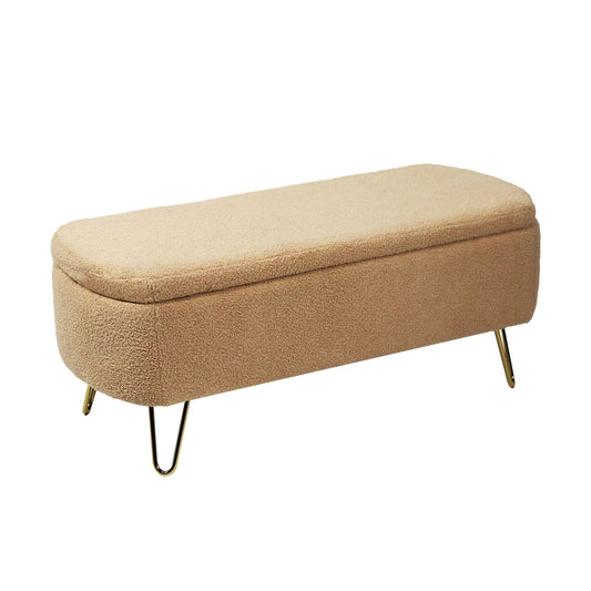 A modern camel faux fur storage ottoman bench with gold legs, upholstered and padded, designed for the end of the bed or entryway, shown against a white background.