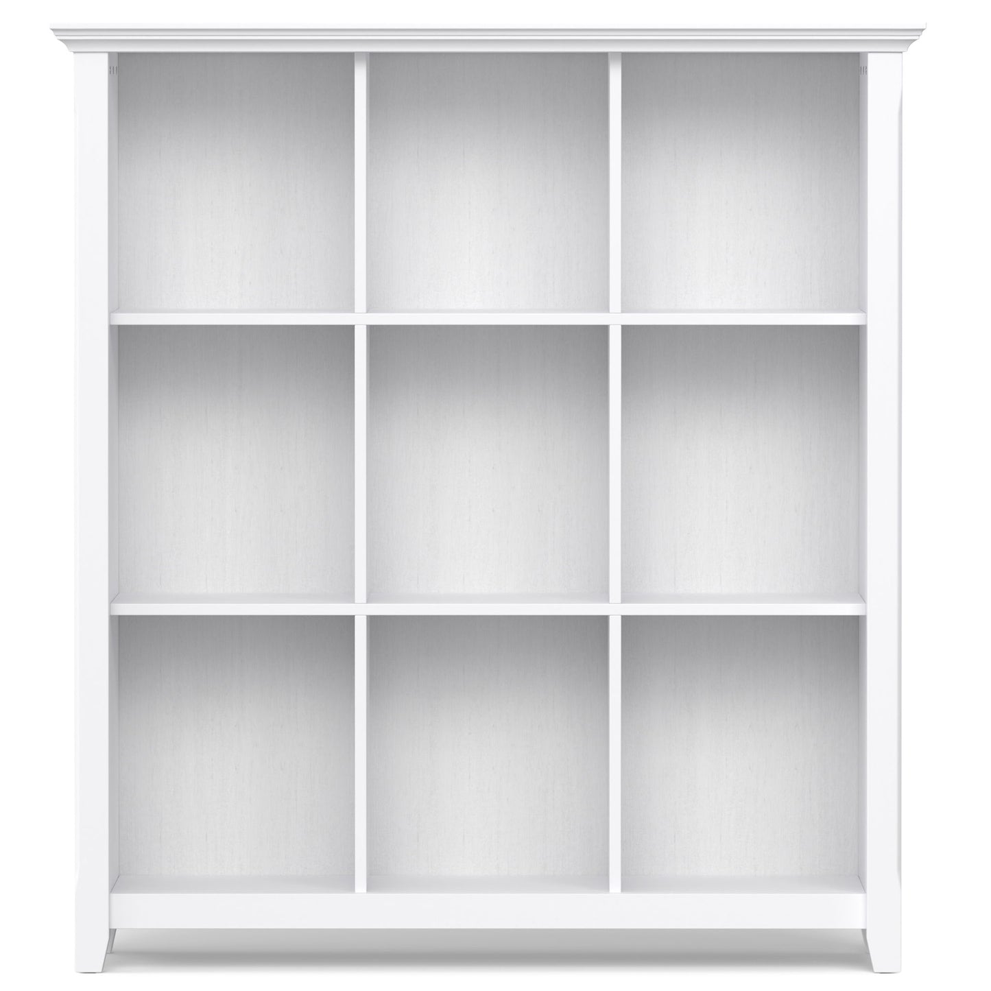 The Acadian - Handcrafted Cube Storage is a white bookshelf featuring a clean, modern design with three rows and three columns forming nine equal rectangular compartments against a plain background.