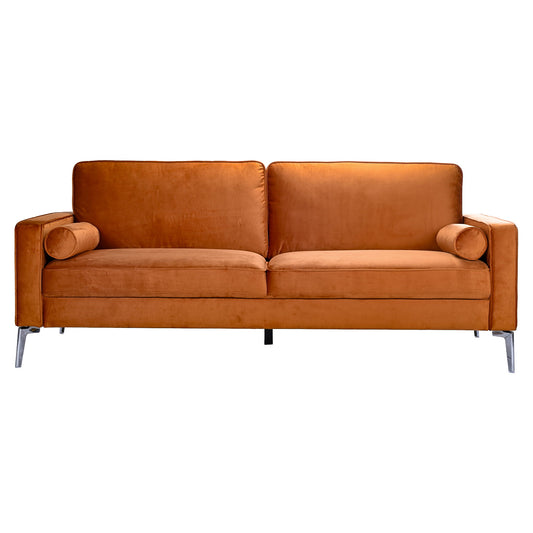 The Axten - Sofa - Orange features modern orange velvet upholstery, two seat and back cushions, matching cylindrical bolster pillows, and slim metal legs, all shown against a white background.