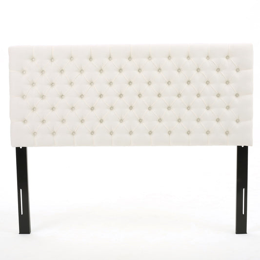 The Annecy - Contemporary Upholstered Headboard features a white tufted design with diamond-patterned button detailing and two black wooden legs, shown against a plain white background.