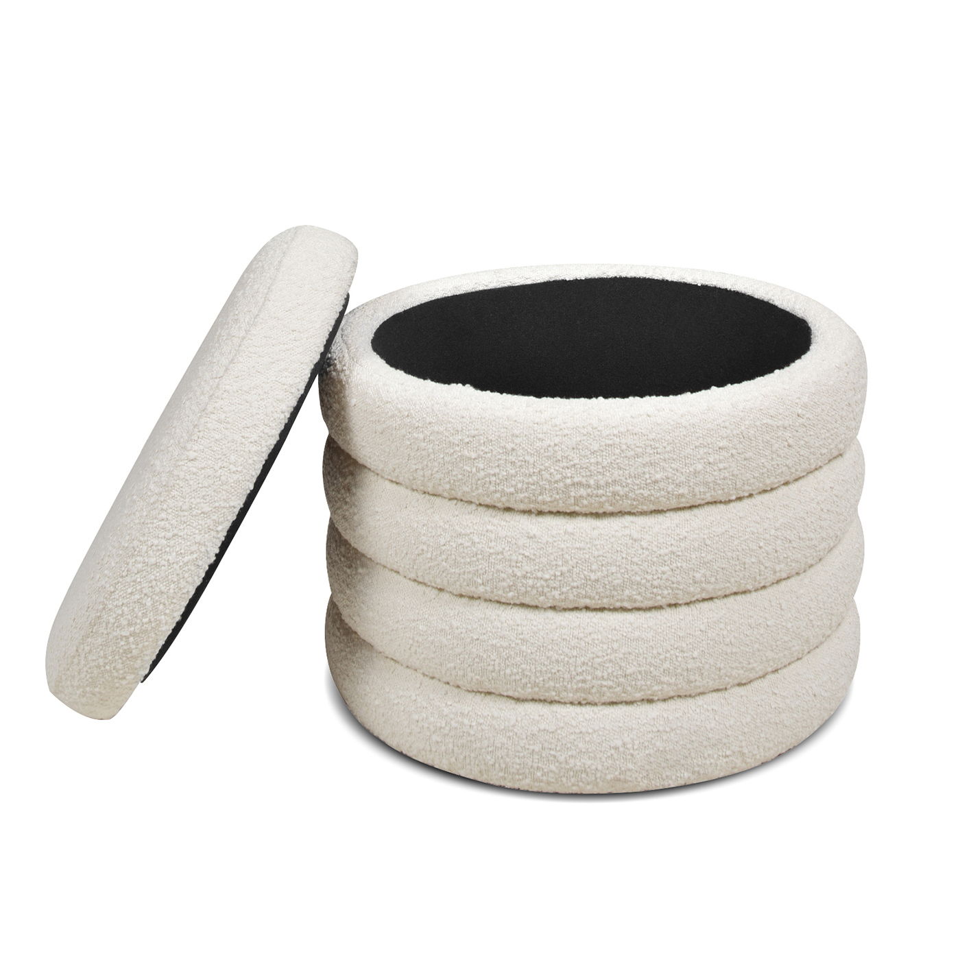 The Fuji Oversized Round Storage Ottoman is shown in cream fleece, featuring donut-like stacked sides and a black-lined interior. The removable lid rests to the side, revealing the spacious storage opening inside.