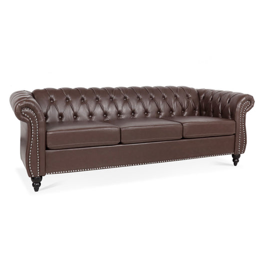 The Rolled Arm Chesterfield 3 Seater Sofa features brown leather upholstery, a tufted backrest, rolled arms, three seat cushions, nailhead trim accents, and black wooden legs.
