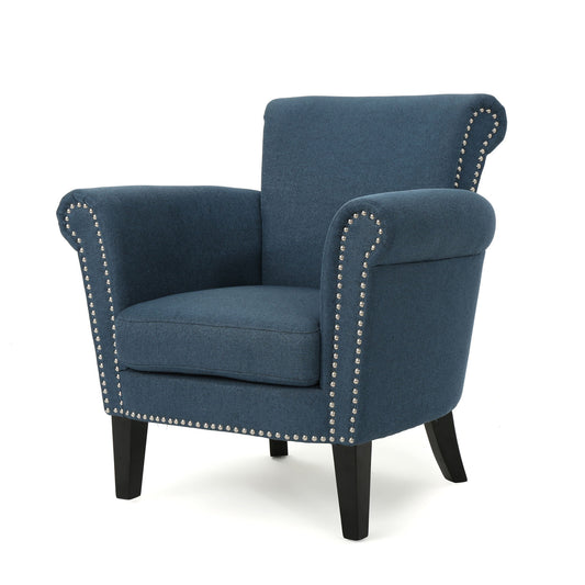 The Elegant Club Chair features blue upholstery, rolled arms and back, silver nailhead trim along the edges, and sturdy dark birch wood legs.