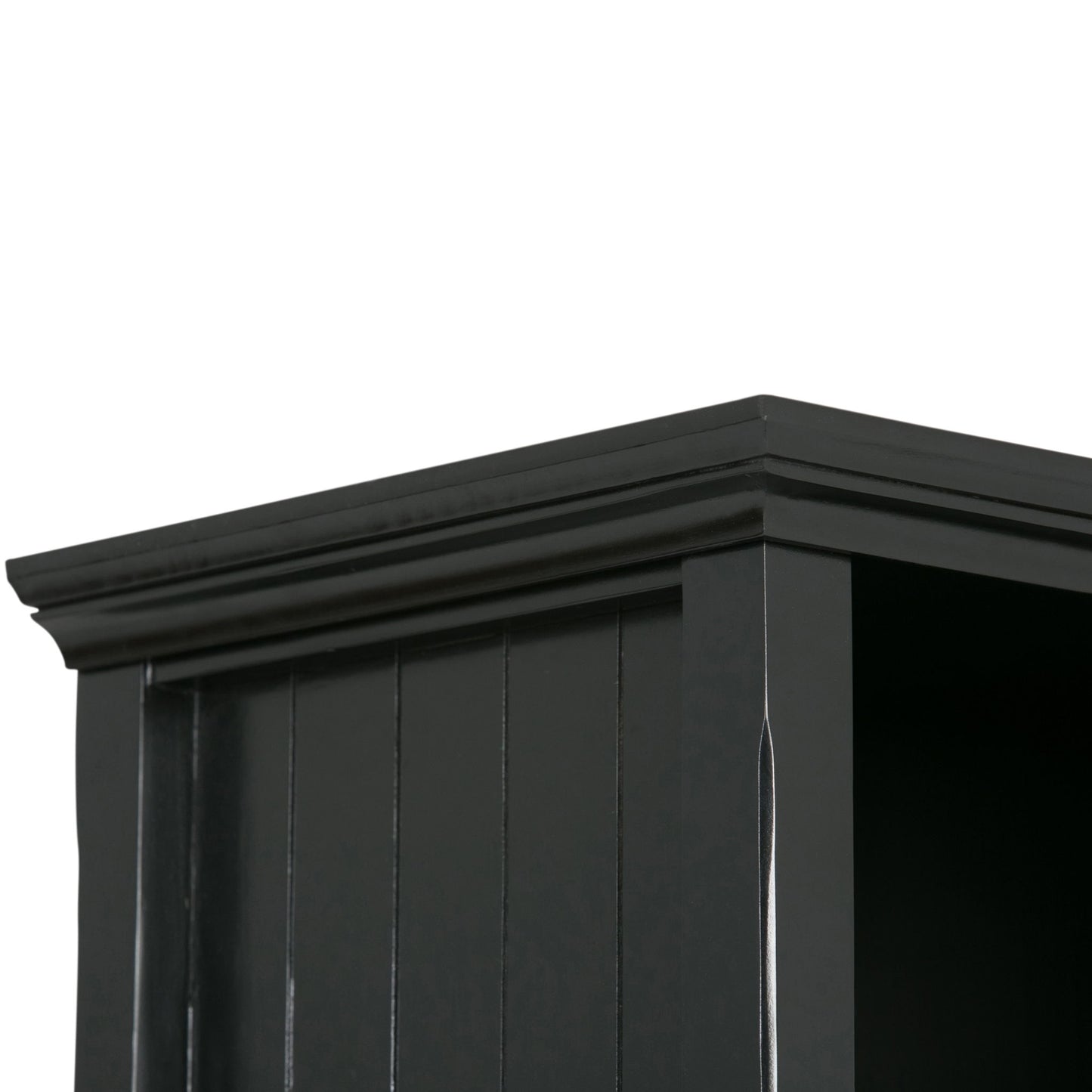 Close-up of the upper corner of the Acadian - Handcrafted Cube Storage, featuring black wood with decorative crown molding and vertical grooves on the side panel.