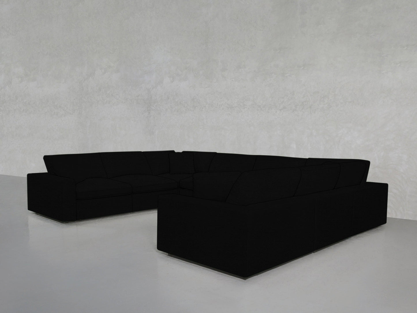 An 8-Seat Modular U-Sectional with plush cushions is placed on a glossy light gray floor against a textured light gray wall in a minimalist, modern room.