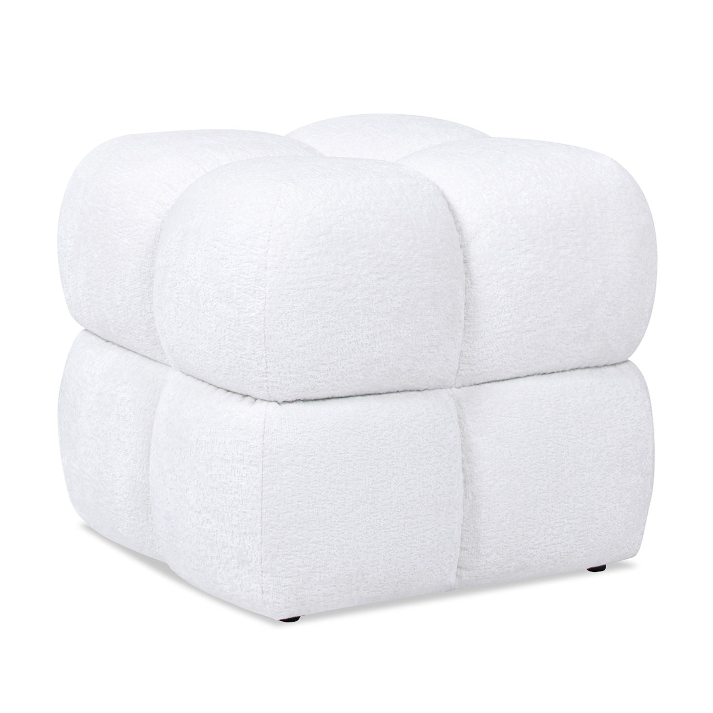 The Pixel Oversized Square Tufted Pouf Ottoman in Almond White features plush, rounded edges, soft textured fabric, and distinctive tufting that divides its modern cube shape into smaller puffy sections.