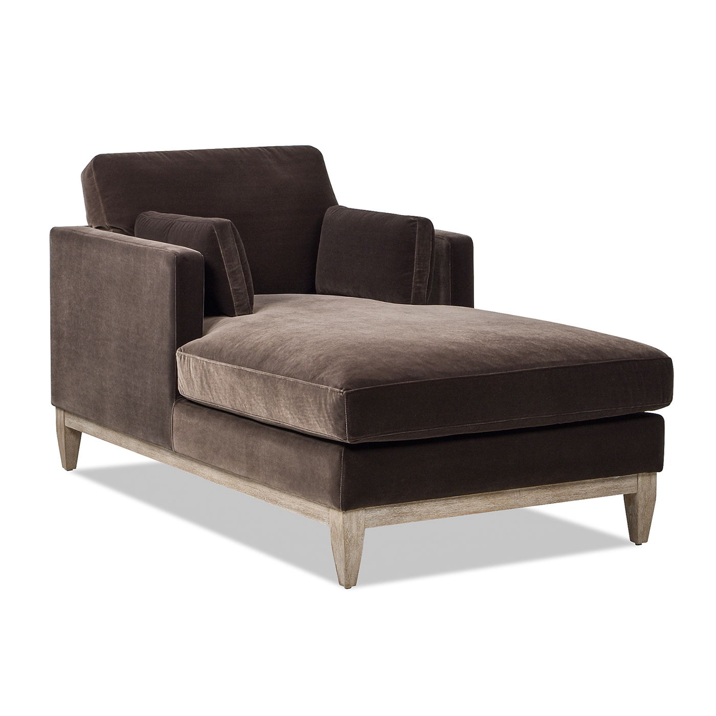 The Knox Modern Farmhouse Chaise Lounge Chair features dark brown upholstery, rectangular cushions, and light wooden legs, displayed against a white background.
