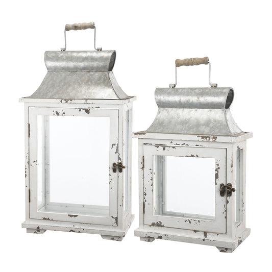 Set of two white Wooden Candle Lantern Decorative hurricane holders with glass panels, metal tops, and wooden handles. One is taller; both feature a rustic, weathered finish—perfect for indoor or outdoor home, garden, or wedding decor.