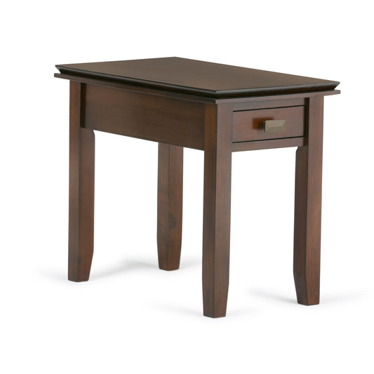 The Artisan - Handcrafted Narrow Side Table features a dark brown wooden finish, four straight legs, and a small drawer with a metal handle beneath the tabletop.