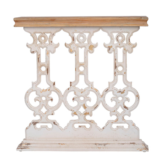 The Classic Vintage Wash Console Table features a brown wood top and an antique white ornate base with intricate scrollwork, set against a plain white background.