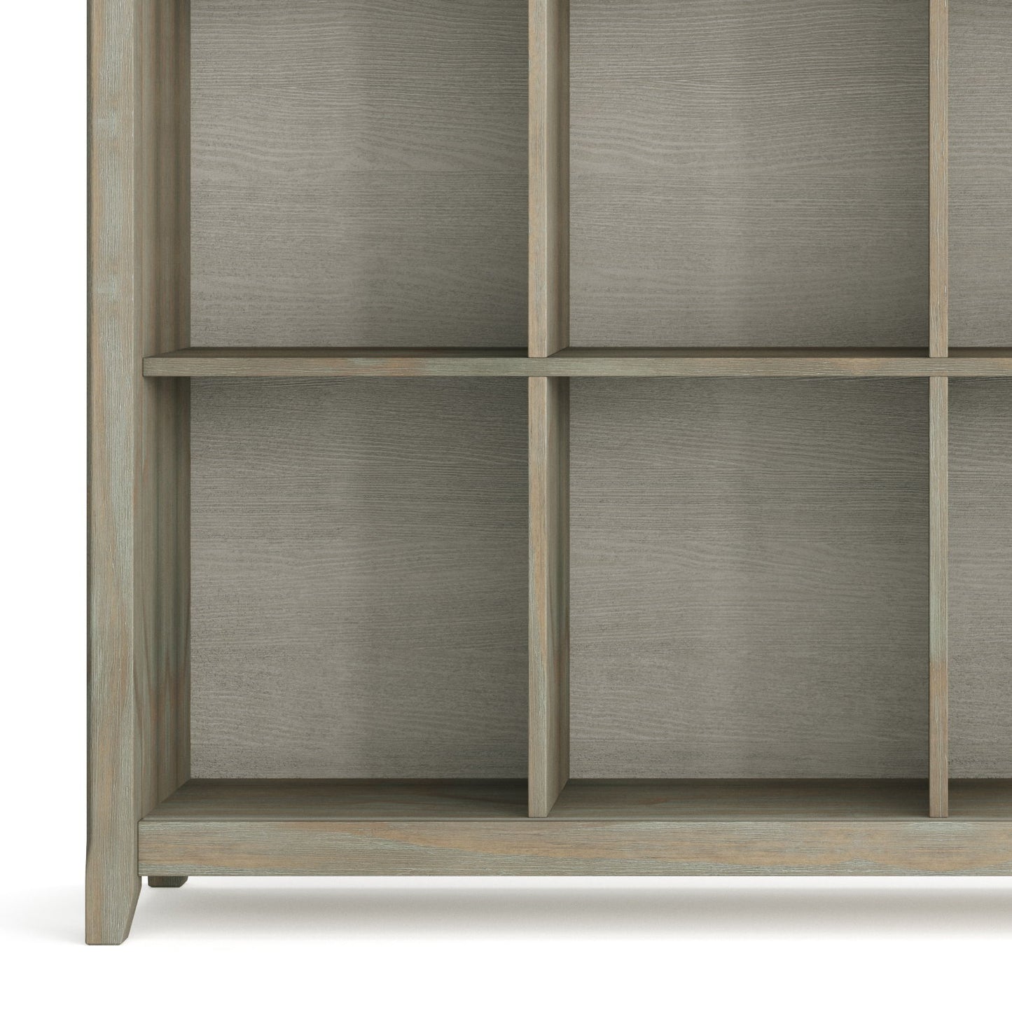 A close-up of the lower part of the Acadian - Handcrafted Cube Storage, showcasing its grid design with square compartments and a light grayish-brown finish. The shelves are empty.