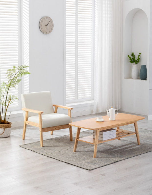 Bright, minimalist living room featuring the Bahamas - Coffee Table And Chair (Set of 2) on a gray rug, with white walls, blinds, a potted plant, wall clock, and decorative vases on a shelf.