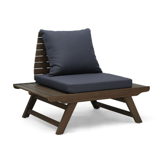 The Sedona Outdoor Club Chair features a slatted design, angled wooden legs, wide armrests, and dark seat and back cushions, shown against a white background.