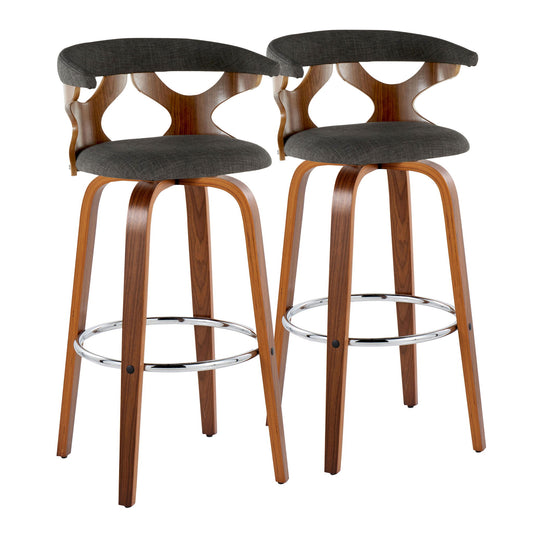 The Gardenia Mid Century Modern Fixed Height Barstool (Set of 2) features curved wooden backs with open cutouts, black fabric seats, and angled wooden legs joined by a round chrome footrest. Swivel functionality adds modern comfort.